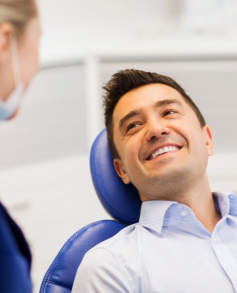 Man smiling at his periodontist
