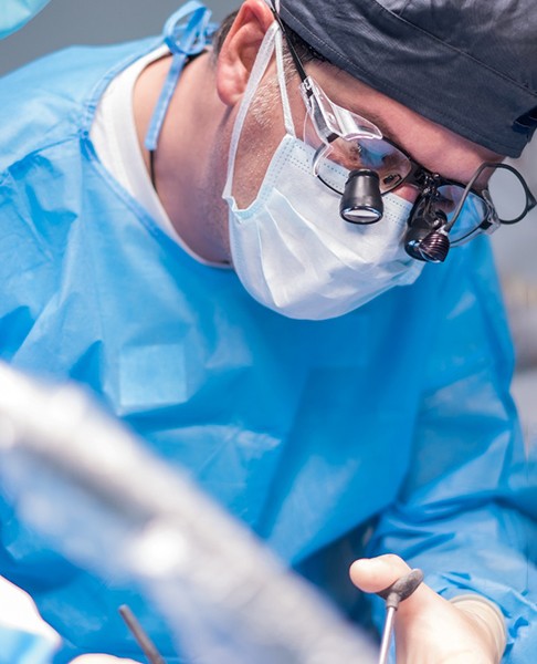 Dentist performing a tooth extraction procedure