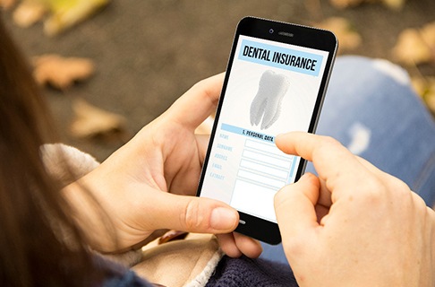 A person looking at dental insurance information on their phone