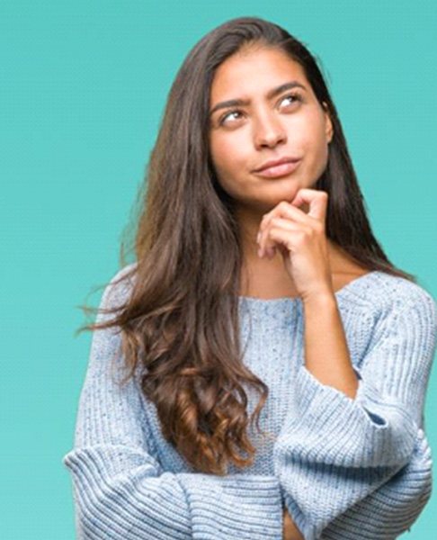 Thinking woman with a curious expression on her face