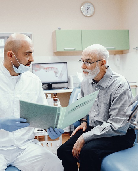 Senior man at a consultation for dental implants