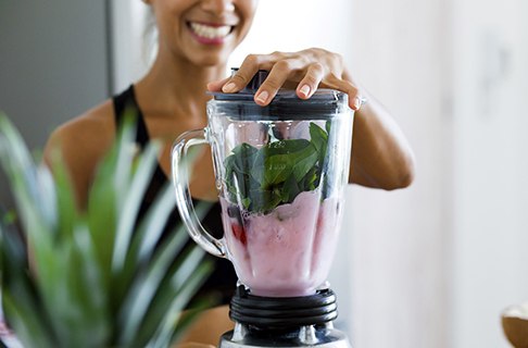 Woman making a smoothie
