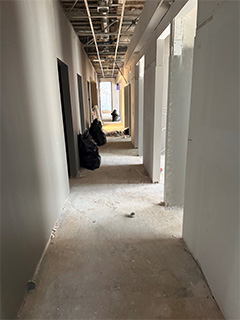 Hallways with walls in process of being painted