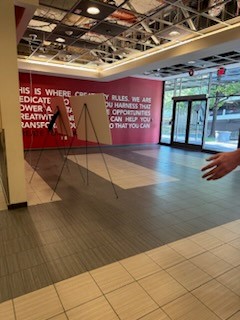 Tiled floor with sign in distance