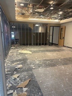 Floor of in-progress building with debris on it