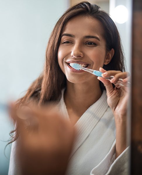 Woman brushing her teeth