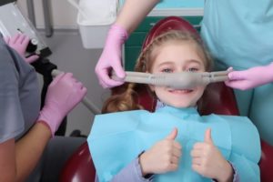 young patient smiling before her dental appointment